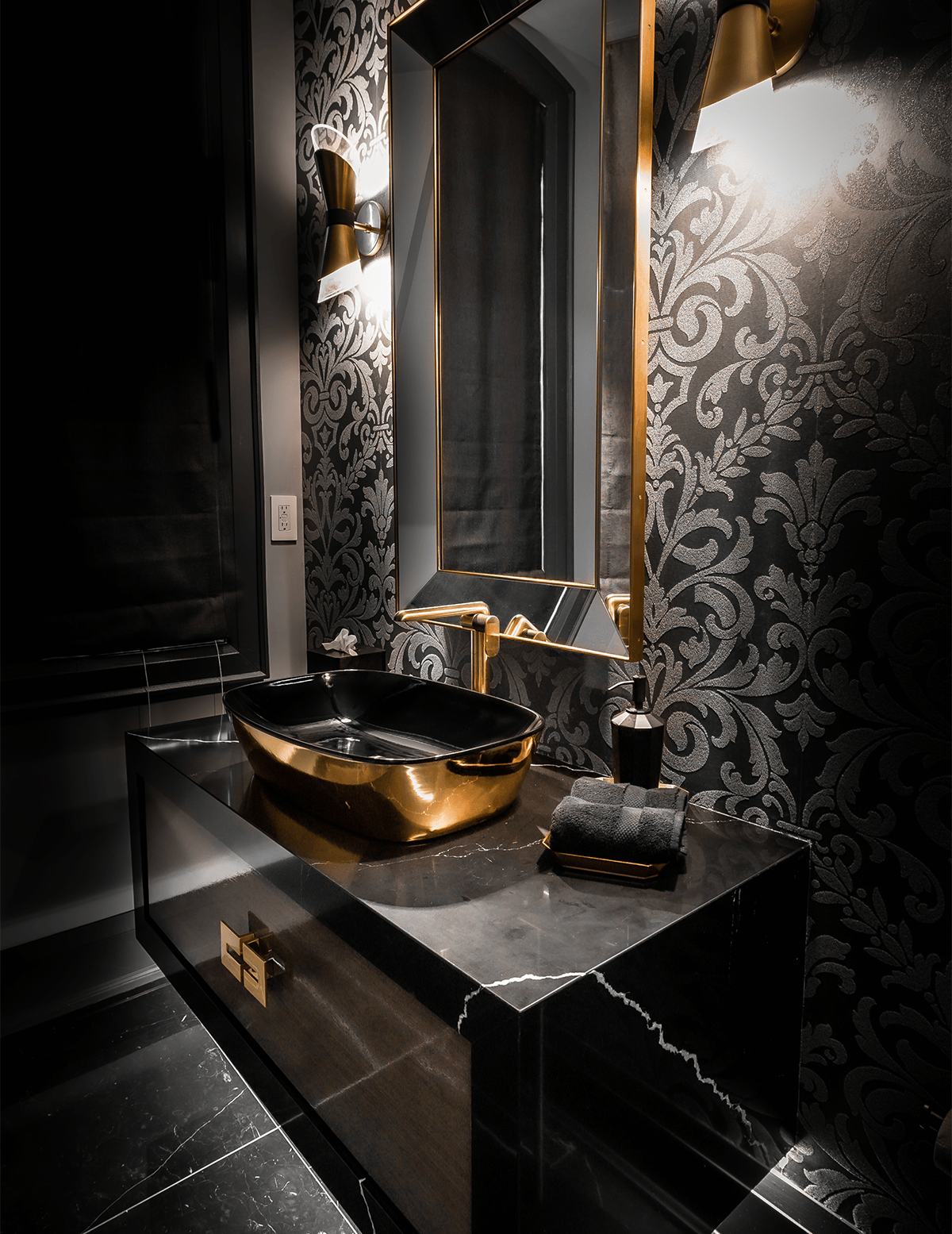 Gold vessel sink and dark marble vanity, Reno Gurus bathroom renovation.