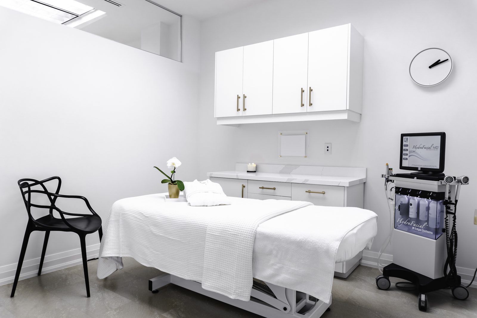 Treatment room with white millwork and marble counter, Sonya's Med Spa, Oakville.