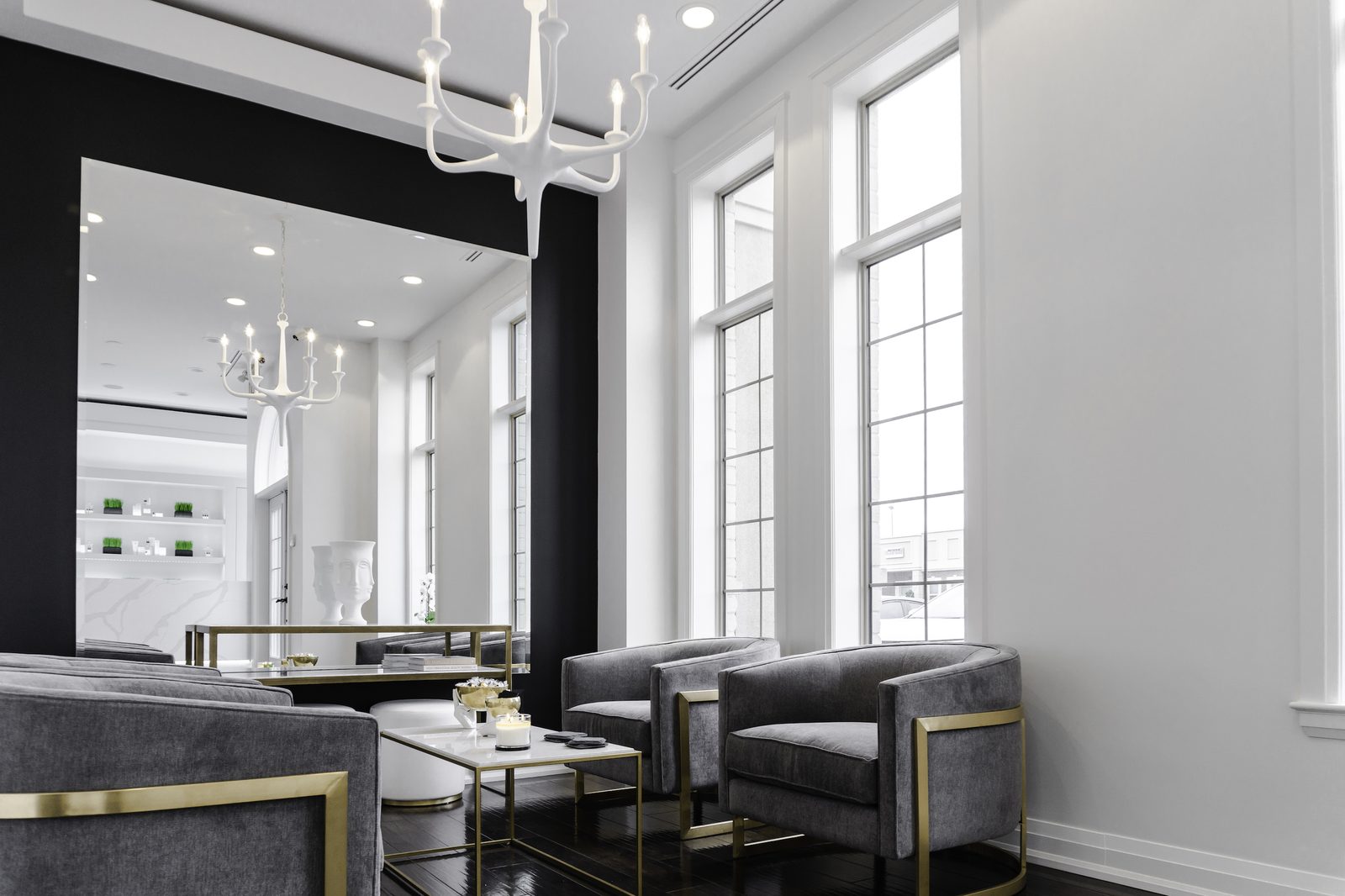Lounge seating by tall windows, Sonya's Med Spa, Oakville.